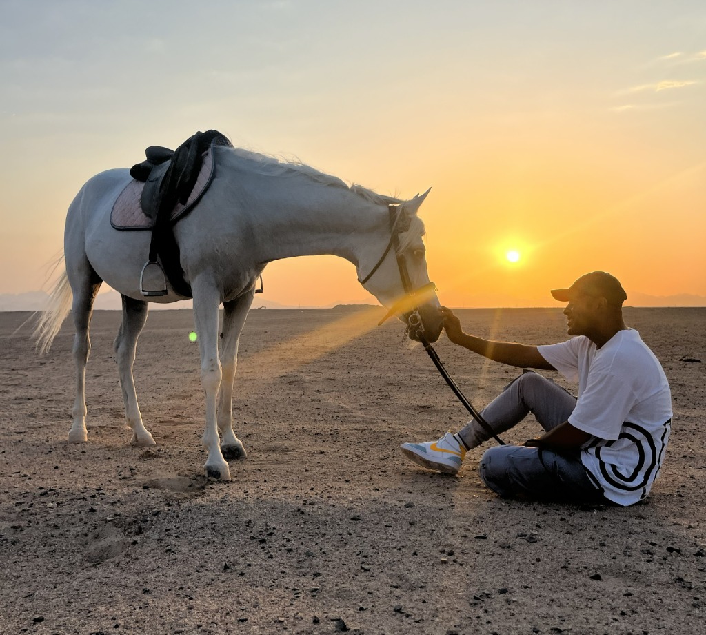 Sam with horse at sunset