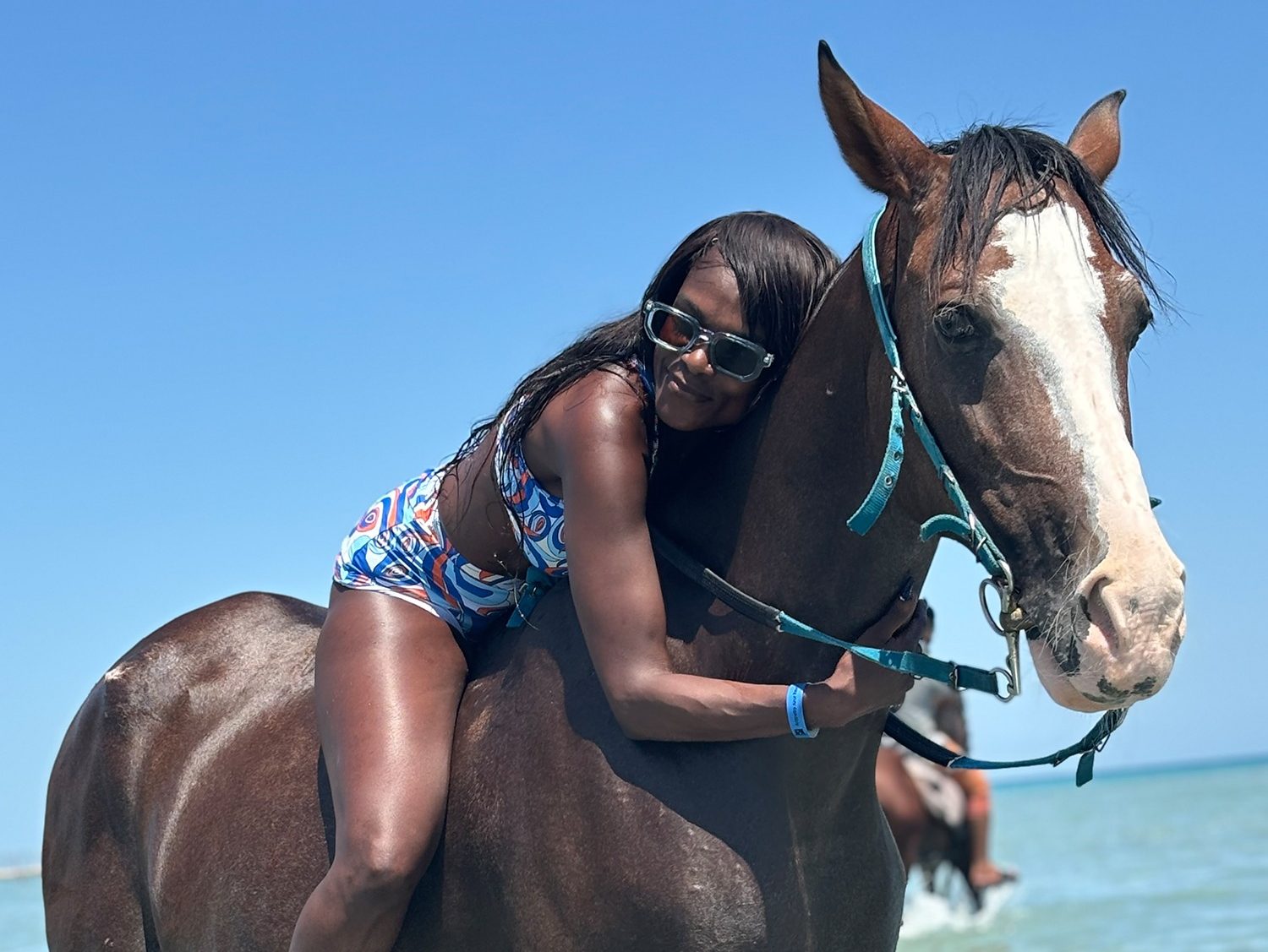 Group of guests with horses at the Red Sea