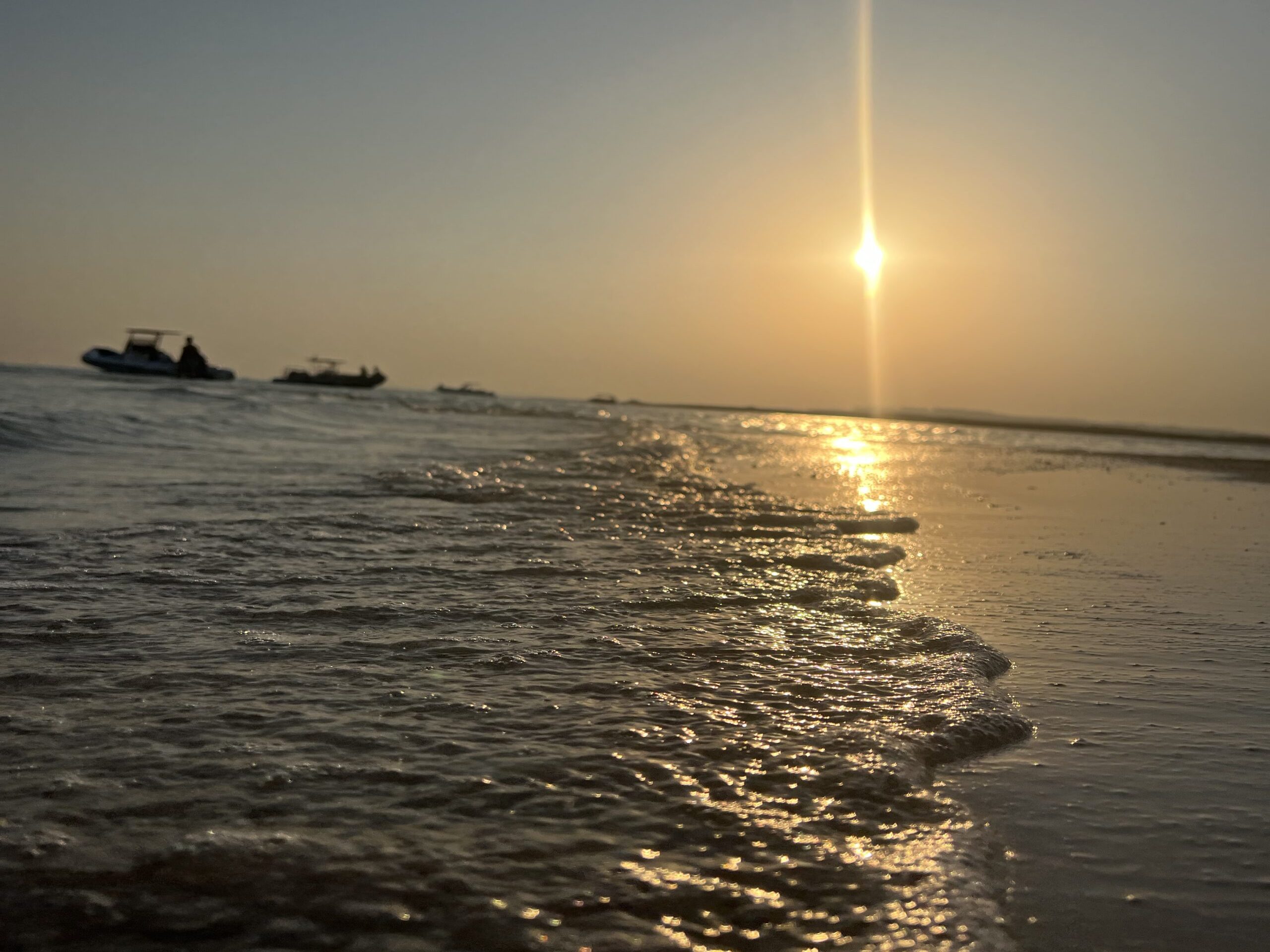 Guests walking on a shallow sandbank during the Sunset Island Trip from Hurghada