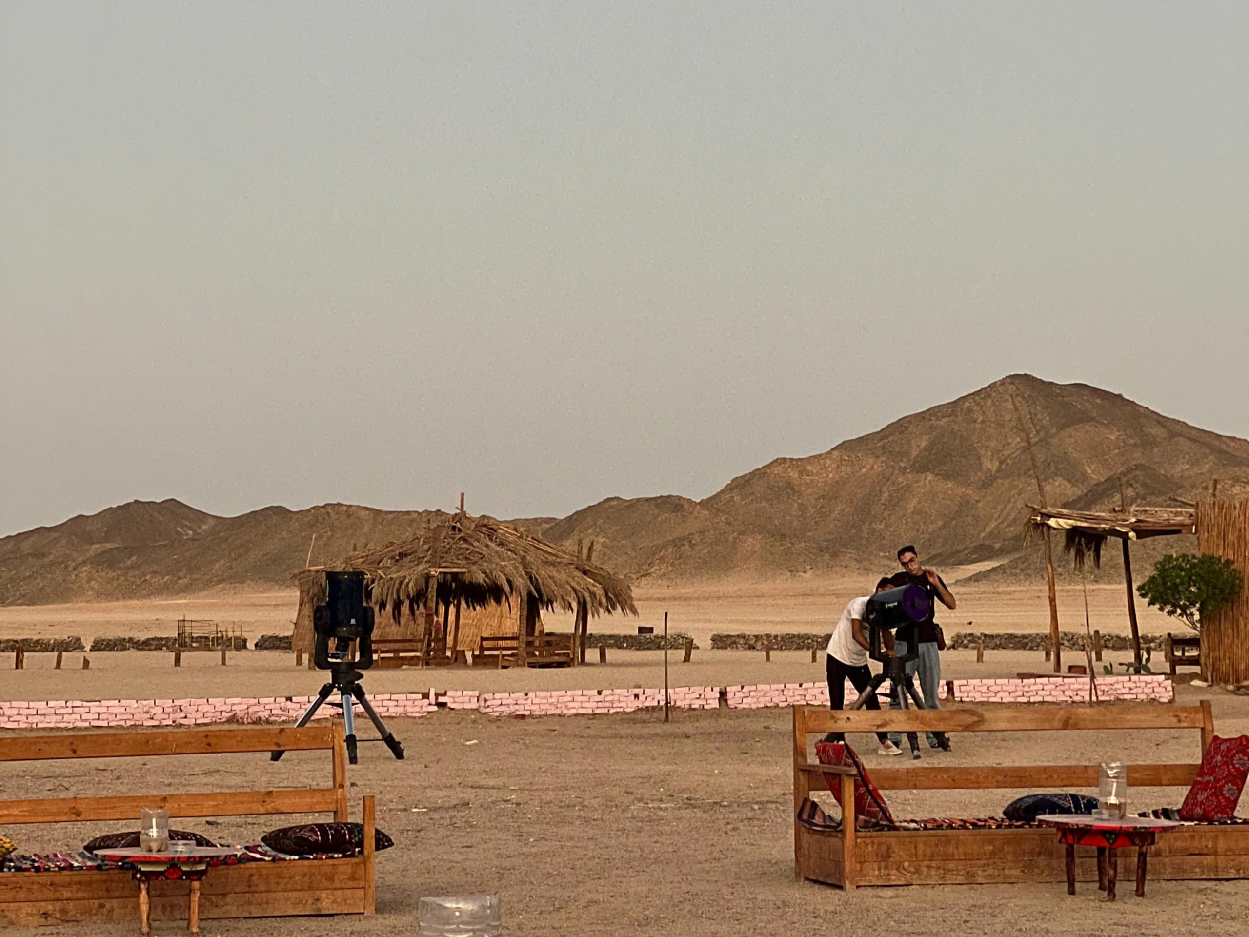 Guests sitting under the stars at a Bedouin camp
